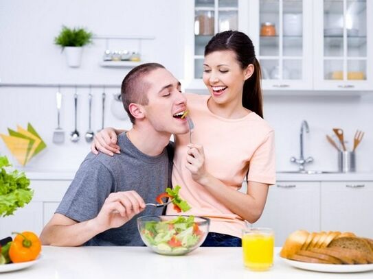 Girl feeds product to her man to increase potency